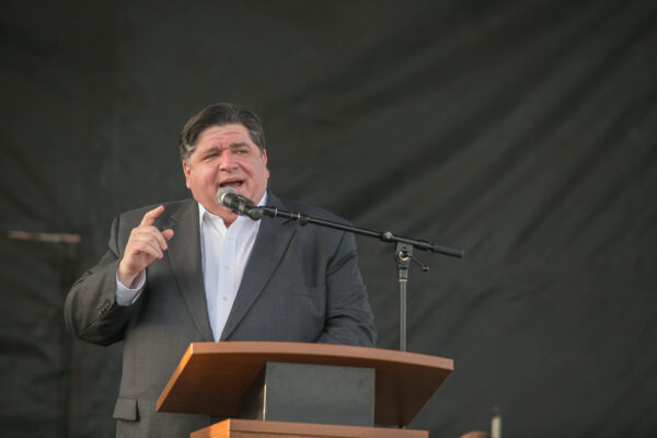 Gov Pritzker speaking at Victory's peace march